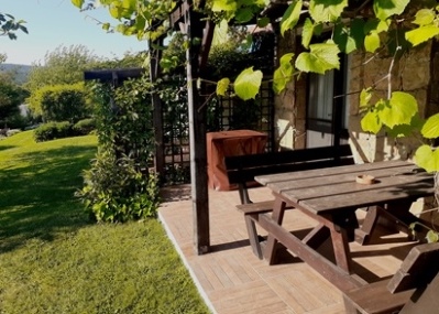 terrace with garden views and an outdoor dining area with barbeque (gas) 